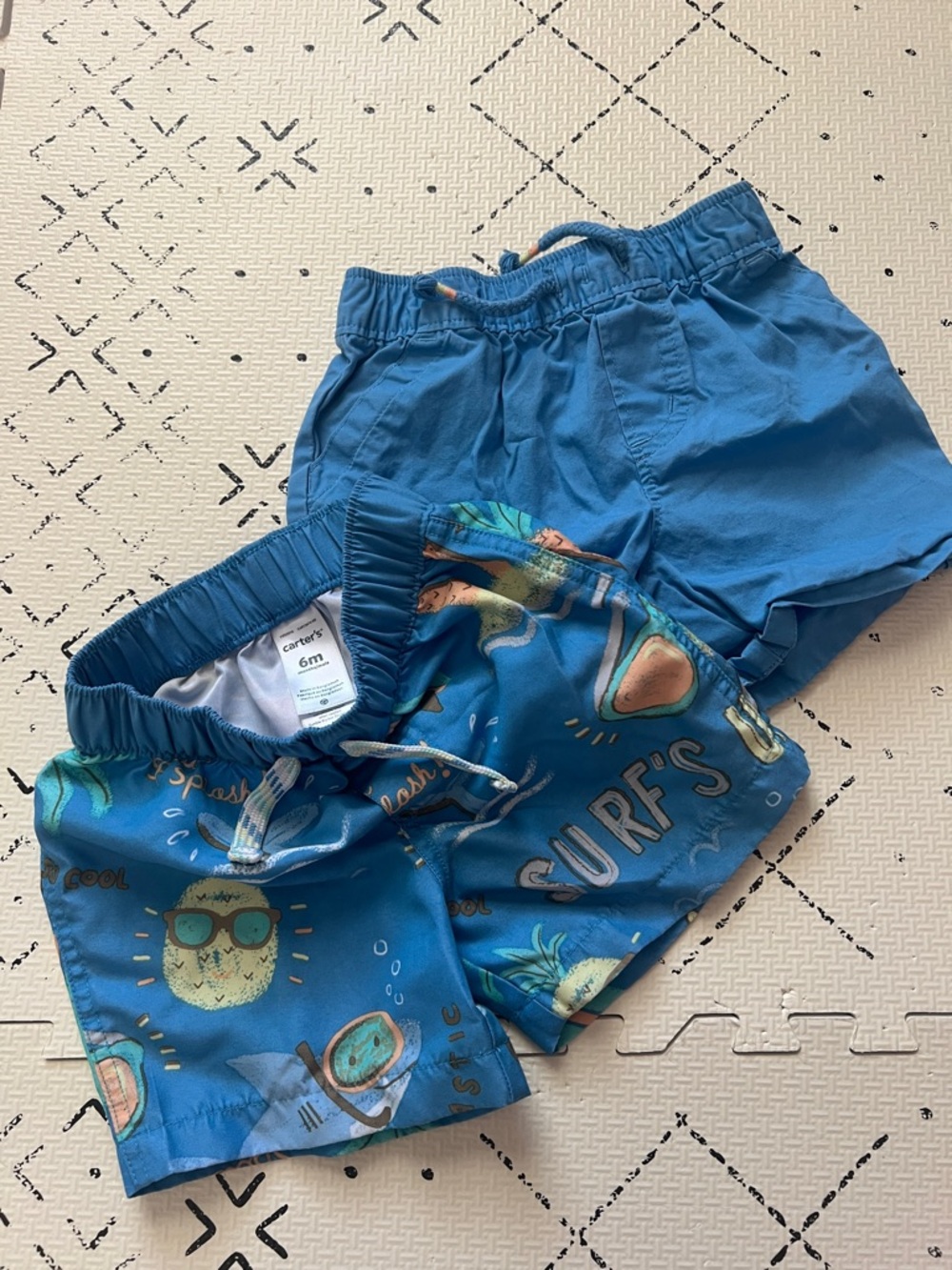 Two Carter’s 6 month swim trunks